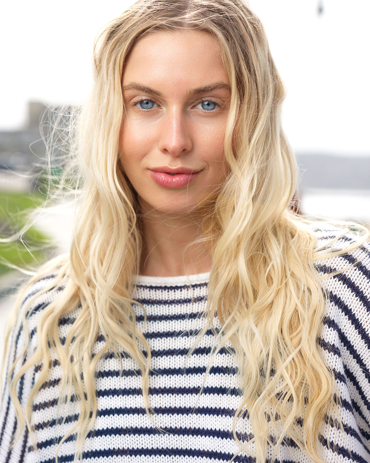 Actor headshot of a blonde woman in a navy striped sweater photographed outdoors at a San Diego coastal location — Headshots by Guffy, San Diego